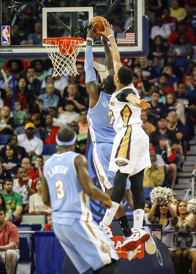 New Orleans’ Anthony Davis blocks a shot by J.J. Hickson. (Associated Press)