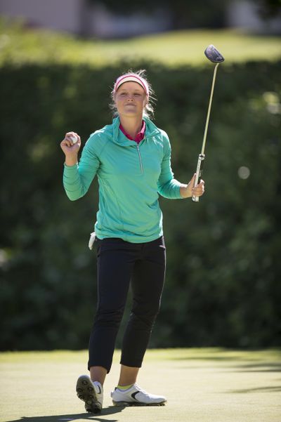 Brooke Henderson, of Canada, celebrates on the 18th green after winning the LPGA Cambia Portland Classic golf tournament Sunday. (Troy Wayrynen / Associated Press)