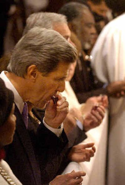 
Democratic presidential candidate Sen. John Kerry, D-Mass., center left, takes Communion during Palm Sunday services at the Charles St. AME church in Boston's Roxbury district in April.Democratic presidential candidate Sen. John Kerry, D-Mass., center left, takes Communion during Palm Sunday services at the Charles St. AME church in Boston's Roxbury district in April.
 (File/Associated PressFile/Associated Press / The Spokesman-Review)