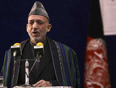 
Afghan President Hamid Karzai, seen Sunday, is reportedly working on nonmilitary means to end conflict with the Taliban. Associated Press
 (Associated Press / The Spokesman-Review)