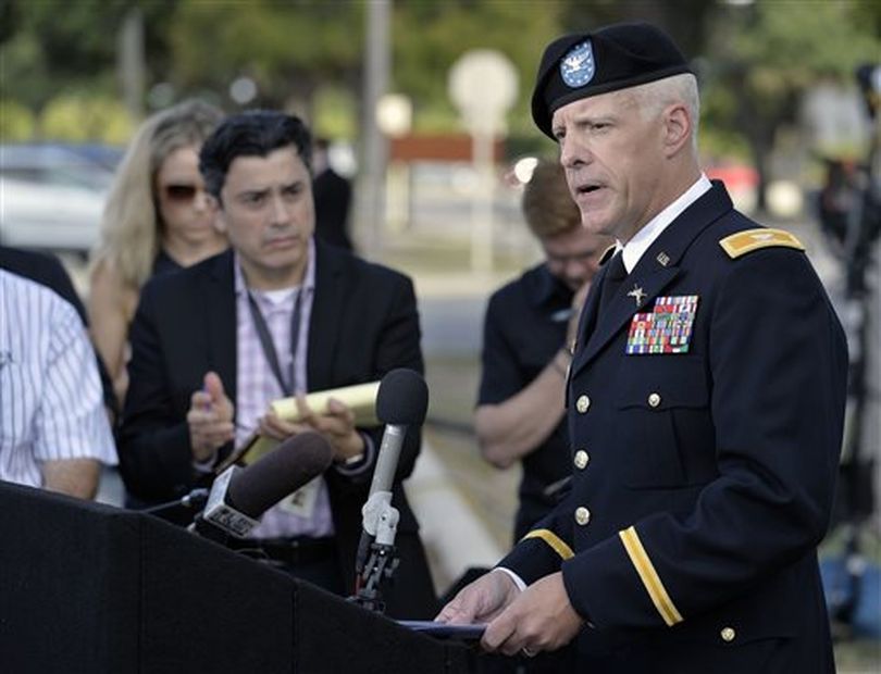 Col. Daniel J.W. King, right, U.S. Army Forces Command Director of Public Affairs, speaks to members of the media after a preliminary hearing to determine if Sgt. Bowe Bergdahl should face a court-martial (AP / Darren Abate)