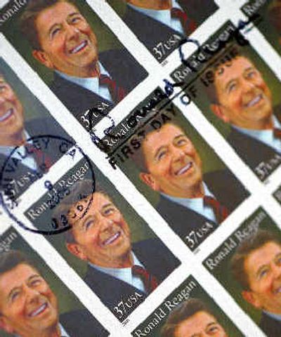 
 Ronald Reagan fans and collectors received the commemorative signature of Reagan on his new postage stamp.
 (Associated Press / The Spokesman-Review)