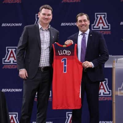 Arizona basketball coach Tommy Lloyd, left, and athletic director Dave Heeke pose during Lloyd’s introductory news conference Thursday in Tucson, Arizona.  (Courtesy of Arizona athletics)