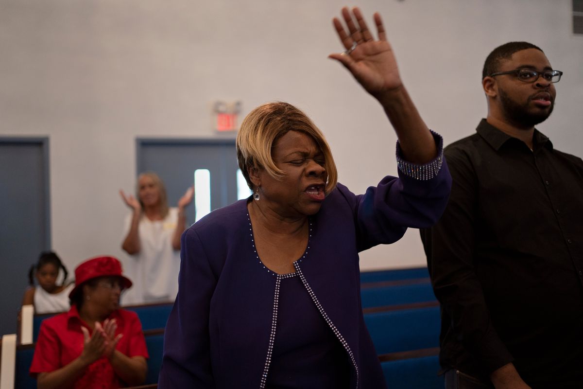 Lois Malvo, left, attends church with her nephew at the Tabernacle of Praise Worship Center in Lake Charles, La., on Oct. 1. MUST CREDIT: Danielle Villasana for The Washington Post  (Danielle Villasana/For The Washington Post)