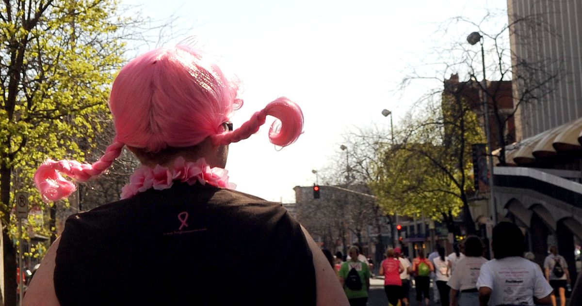 Otis Orchards resident Andrea Porter wore a pink wig while runing in the Susan G Komen Race for the Cure in Spokane on Sunday, April 22, 2012. (Kathy Plonka)