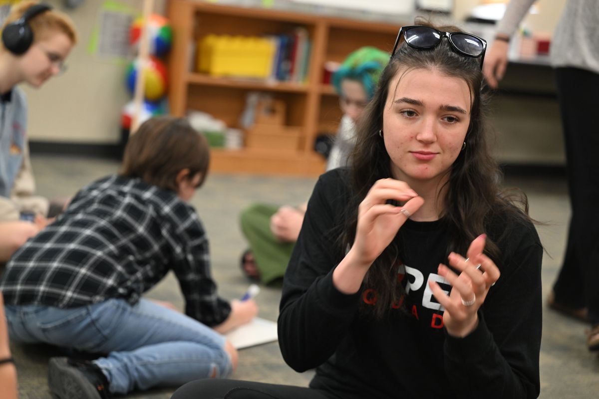 Grace Oakley, a junior at Ferris High School, plays a language game with her classmates Monday during her American Sign Language III class at Ferris High School. Oakley, who is hard of hearing, recently won a statewide contest based on ASL, deaf culture and history and ASL storytelling. (Jesse Tinsley/THE SPOKESMAN-REVIEW)