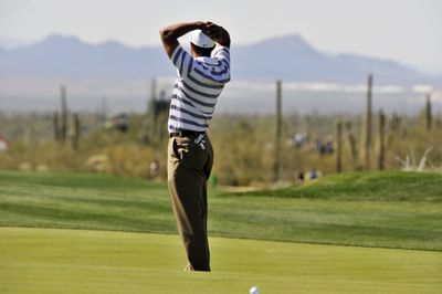 Tiger Woods missed a birdie putt on the ninth hole against Tim Clark.  (Associated Press / The Spokesman-Review)