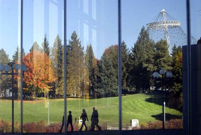 
Clear skies and mild temperatures make for great strolling weather during the noon hour Wednesday in Riverfront Park. Walkers and the park's vivid fall foliage are reflected in the breezeway windows of the Spokane Convention Center. 
 (Dan Pelle / The Spokesman-Review)