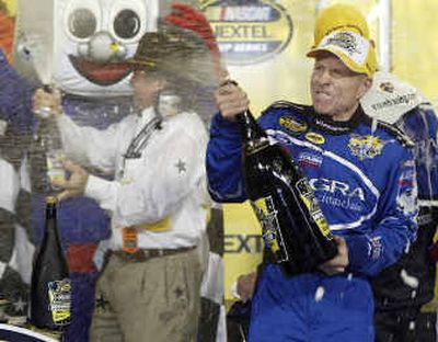
Mark Martin and his Roush Racing team celebrate their win in the NASCAR Nextel All-Star Challenge on Saturday night.  
 (Associated Press / The Spokesman-Review)