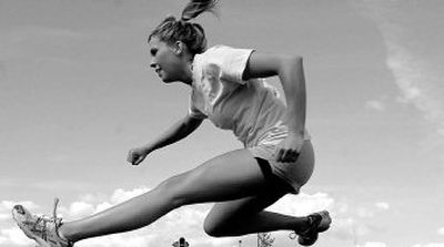 
Post Falls High School senior Dana Werner practices hurdling at the school. 
 (Kathy Plonka / The Spokesman-Review)