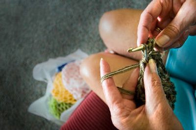 
Georgene Kaplan-Swift knits her 702nd crocheted hat for people dealing with cancer. She donates about 20 hats at a time to cancer centers in area. 
 (CHRISTOPHER ANDERSON / The Spokesman-Review)