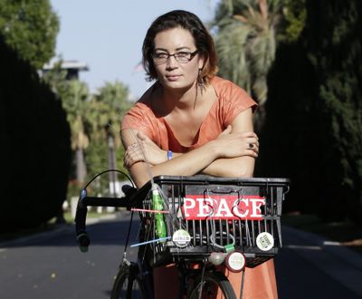 Charis Hill, of Sacramento, Calif., has a rare form of arthritis that affects the spine. She has health insurance under the health care reform law but could not afford medication for her condition because of the plan’s high copays. (Associated Press)
