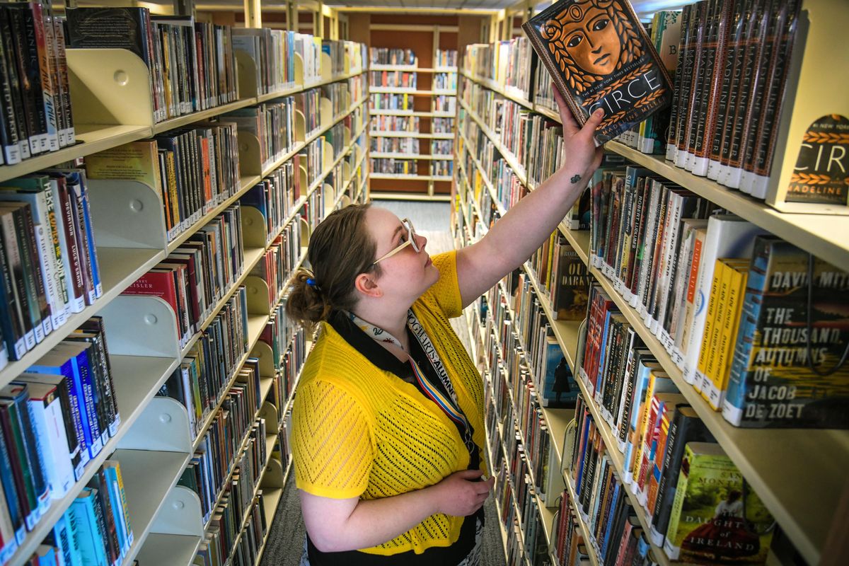 Sara Hanson, public services specialist at the north Spokane branch of the Spokane County Library District, reshelves a copy of Madeline Miller’s “Circe” on Jan. 15. “Circe” was selected as the “Spokane Is Reading” book of 2019 and was the most circulated book of the year in the city and county library systems. (Dan Pelle / The Spokesman-Review)
