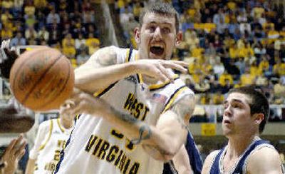 
West Virginia's Kevin Pittsnogle fights for a loose ball. 
 (Associated Press / The Spokesman-Review)