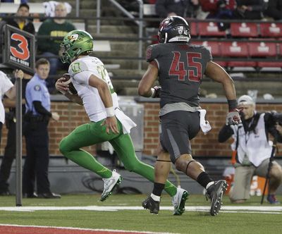 Washington State linebacker Logan Tago (45) has been suspended for a second time. (Young Kwak / Associated Press)