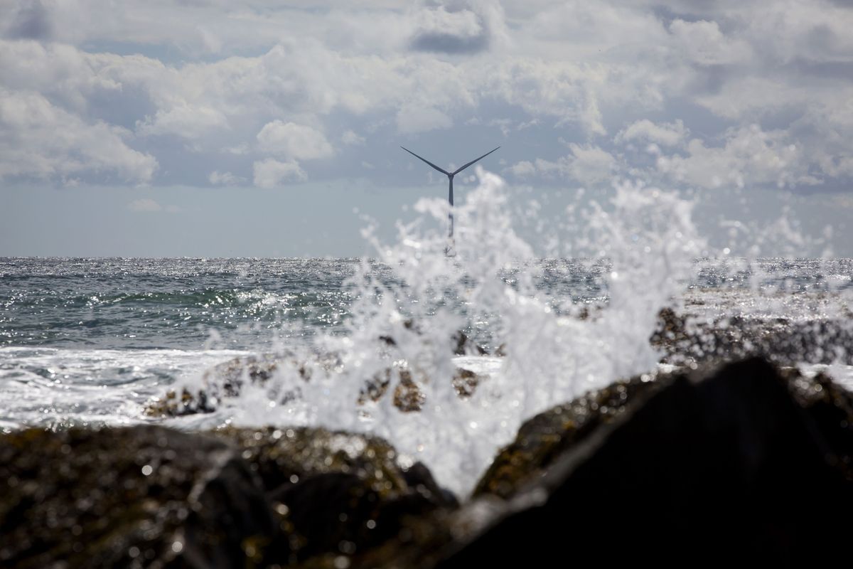 Water splashes on rocks near an Ørsted wind turbine off Block Island, Rhode Island, on Sept. 14, 2016. (Eric Thayer/Bloomberg)