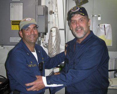 In this photo released by the U.S. Navy, Maersk Alabama Capt. Richard Phillips, right,  stands with Cmdr. Frank Castellano,  of the USS Bainbridge, on Sunday after his rescue off the Somali coast.  (Associated Press / The Spokesman-Review)