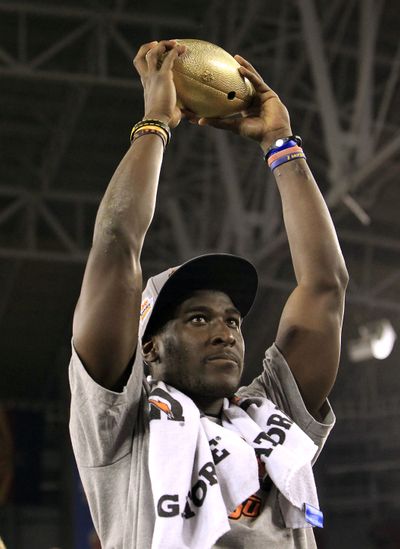 Oklahoma State's Justin Blackmon holds the Fiesta Bowl Championship Trophy after the Cowboys beat Stanford in overtime Monday night in Glendale, Ariz. (Associated Press)