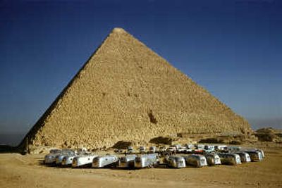 
Airstream travel trailers wagon-wheeled in the shadow of The Great Pyramid at El Gizeh, at the end of the Wally Byam Caravan Club's 