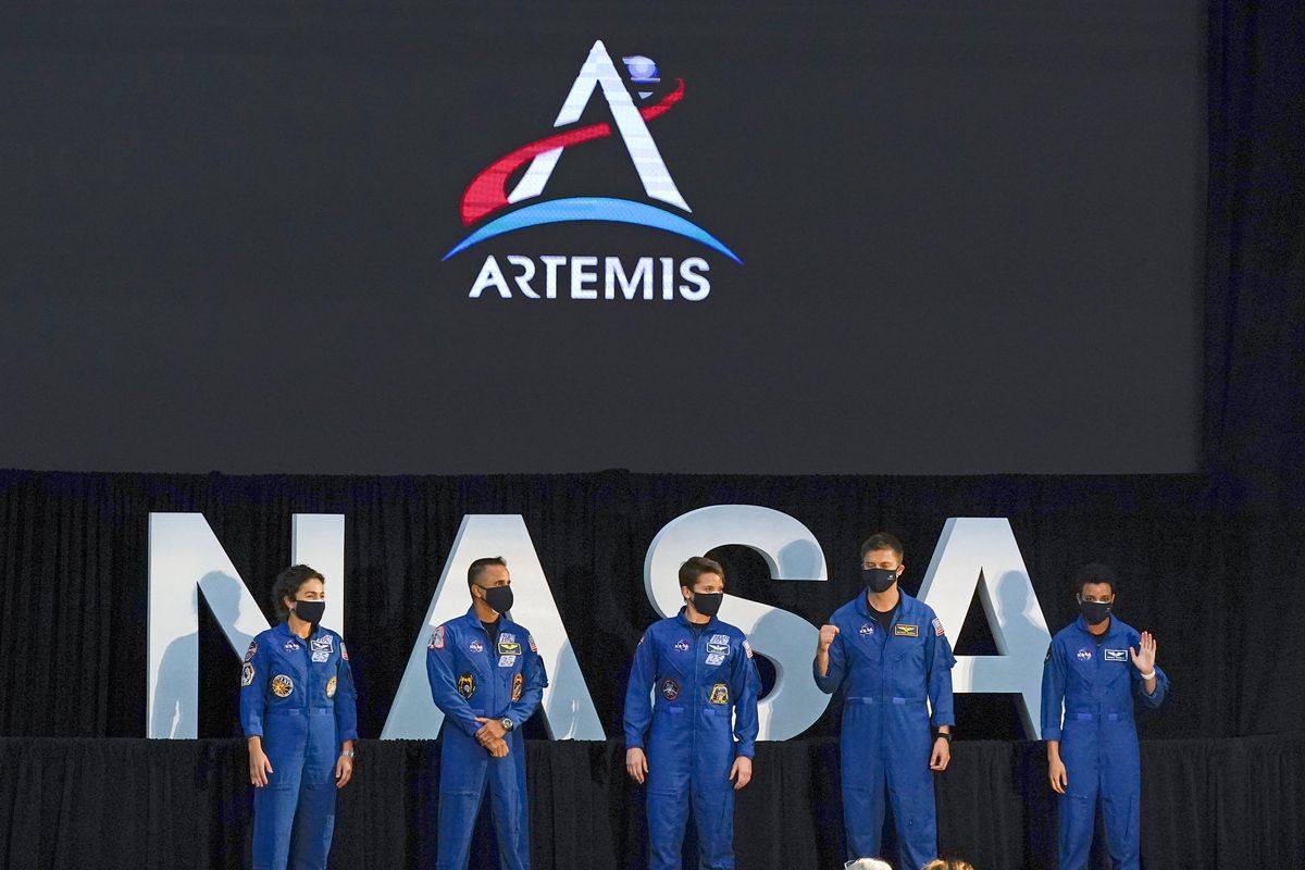 Five of the astronauts that will be part of the Atremis missions, from left, Jessica Meir, Joe Acaba, Anne McClain, Matthew Dominick, and Jessica Watkins are introduced by Vice President Mike Pence during the eighth meeting of the National Space Council at the Kennedy Space Center Wednesday, Dec. 9, 2020, in Cape Canaveral , Fla.   (John Raoux)