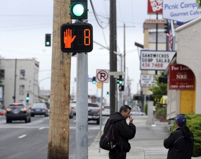 Some of the intersections along downtown Spokane’s Third Avenue have new pedestrian indicators that count down the time from when the “don’t walk” signal begins flashing to when the light changes to red. (Jesse Tinsley)