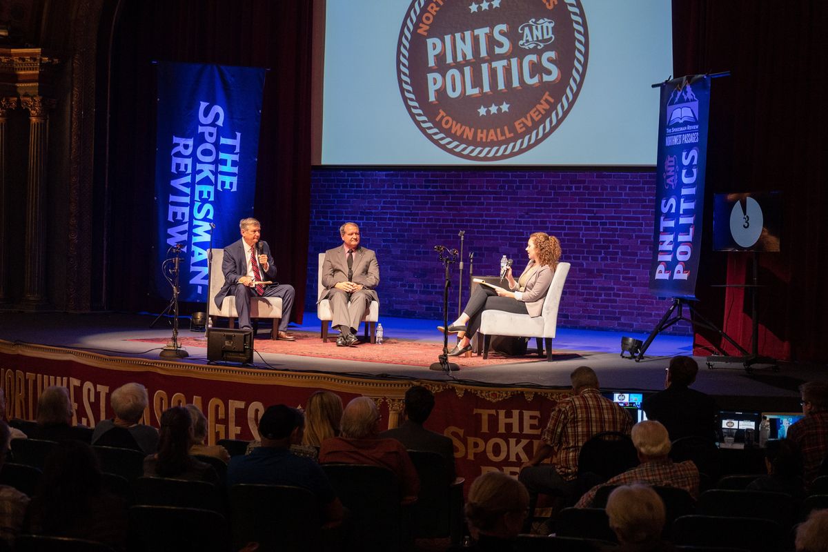 Republicans Rob Chase, left, and Leonard Christian, candidates for the 4th Legislative District (Spokane Valley), debate during the Northwest Passages Pints and Politics Candidate Forum on Thursday at the Bing Crosby Theater in downtown Spokane. Spokesman-Review reporter Laurel Demkovich moderated the debate.  (Colin Mulvany/The Spokesman-Review)