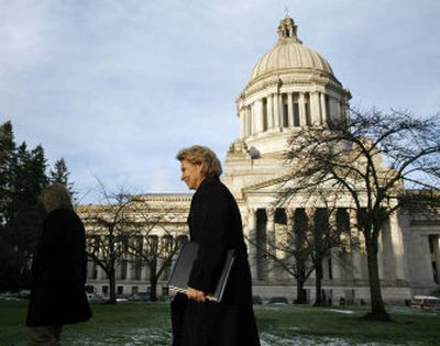 
Gov. Chris Gregoire walks from her office in the Capitol  to speak before the House Appropriations Committee on Wednesday regarding money for education. 
 (Associated Press / The Spokesman-Review)