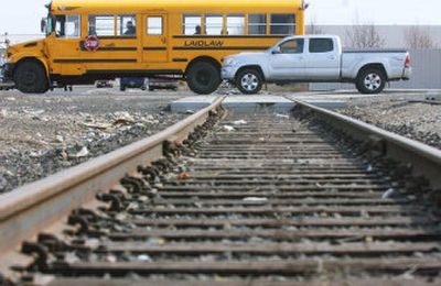 
Vehicles cross the railroad tracks at Freya Street and Alki Avenue. 
 (Kathryn Stevens / The Spokesman-Review)