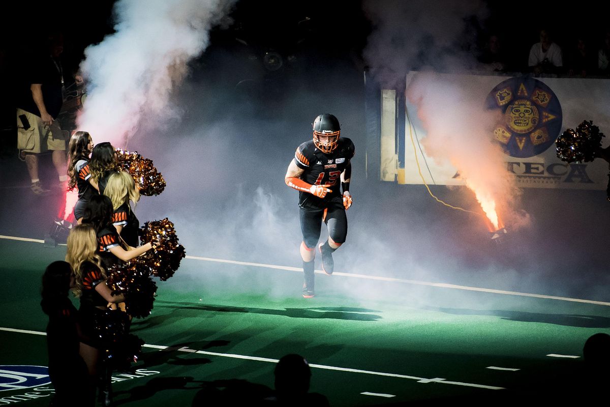 Empire linebacker Pasquale Vacchio (13) takes the field during player introductions, Thurs., Feb. 23, 2017, in the Spokane Arena. (Colin Mulvany / The Spokesman-Review)