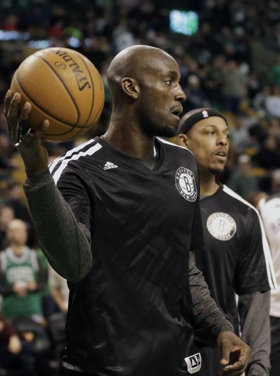 Kevin Garnett, left, and Paul Pierce played their first game in Boston since trade. (Associated Press)