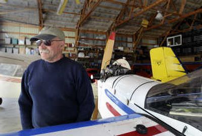 
Roger Dunham, who runs a business building light airplanes and teaching pilots to fly ultralights in the Athol area, stands among some of his planes Friday. The Experimental Aircraft Association has warned its  members of the danger of using fuel with ethanol.  
 (Jesse Tinsley / The Spokesman-Review)