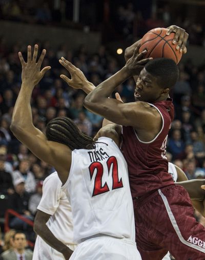 New Mexico St. forward Renaldo Dixon, right, grabs a rebound in the first half. (Colin Mulvany)