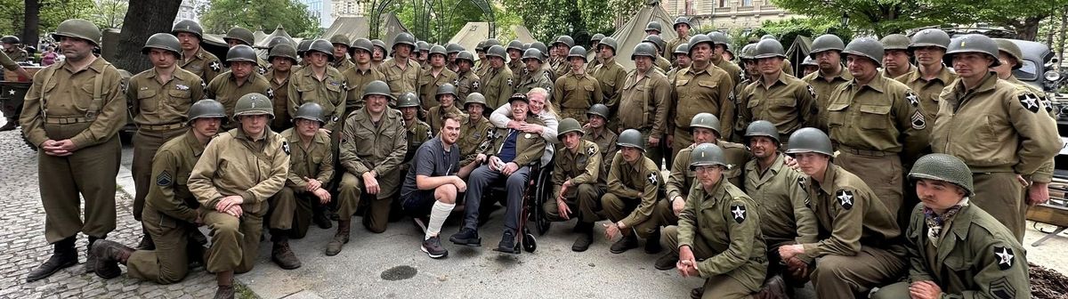 Harry Humason, seated center, received support from Czech Republic residents, some of whom dressed in makeshift U.S. uniforms to honor American soldiers. 