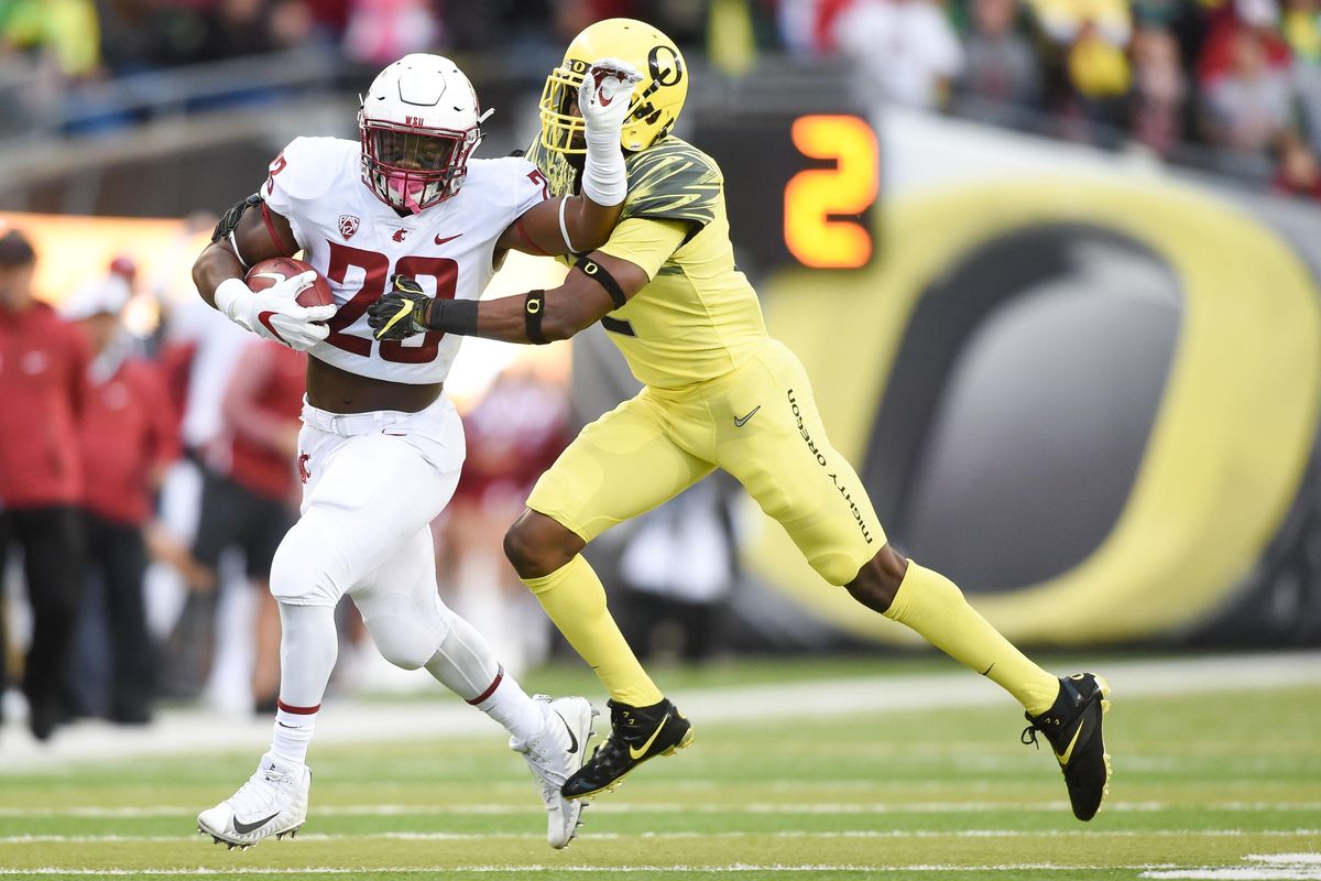Washington State Cougars running back Gerard Wicks (23) runs the ball against Oregon during the first half of a college football game on Saturday, October, 2017, at Autzen Stadium in Eugene. (Tyler Tjomsland / The Spokesman-Review)