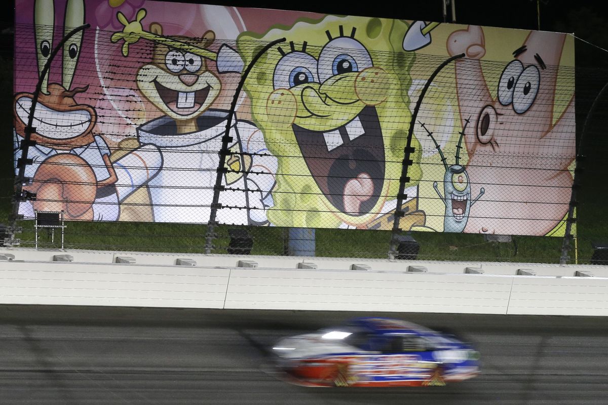 Joey Logano passes by a “SpongeBob SquarePants” billboard. (Associated Press)