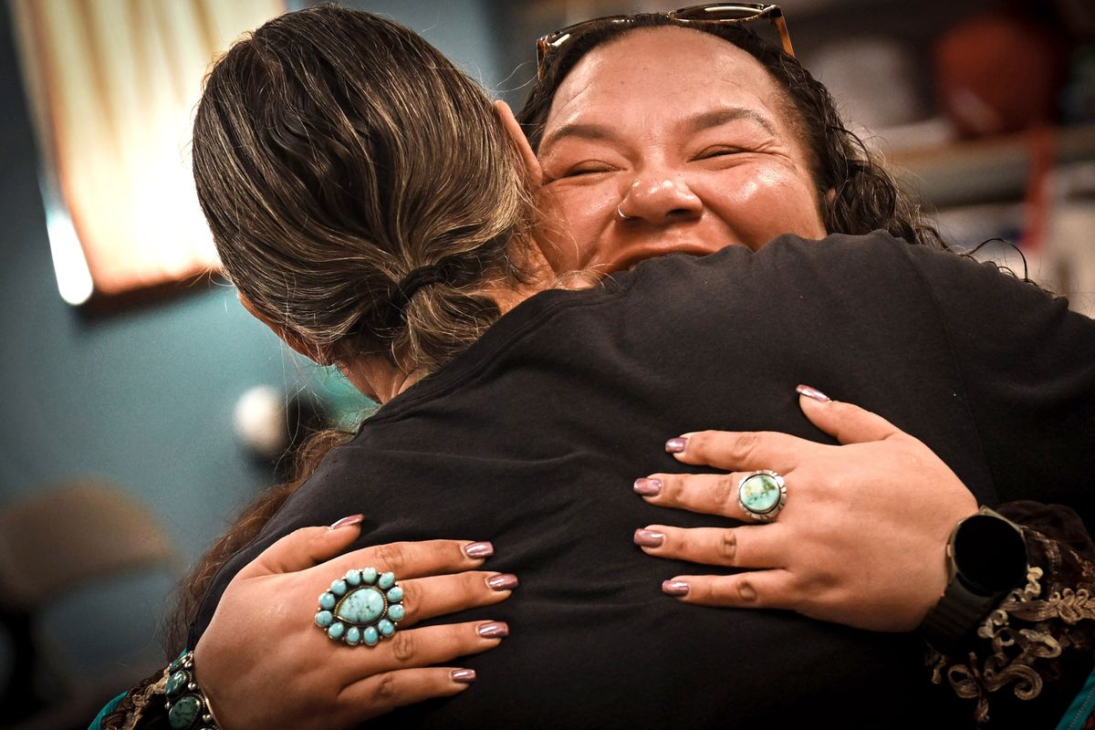 Salish Immersion School student Velma Brehm gets a hug from council member James Rima on Tuesday during the first graduation at the Lemlmts Center in Wellpinit, Wash. The two-year program is for adult tribal members to reach near-fluency in the endangered Native language.  (Kathy Plonka/The Spokesman-Review)