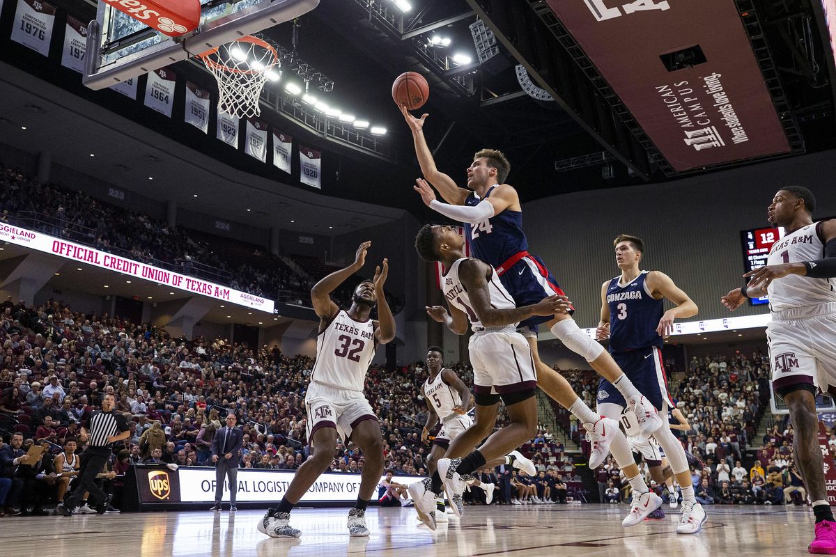 Texas A&M guard Wendell Mitchell (11) draws a charing foul against Gonzaga forward Corey Kispert (24) during the first half of an NCAA college basketball game Friday, Nov. 15, 2019, in College Station, Texas. (Sam Craft / AP)