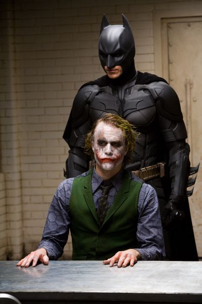 ORG XMIT: NYET161 In this image released by Warner Bros., Heath Ledger starring as The Joker, is shown in a scene with Christian Bale, starring as Batman in 