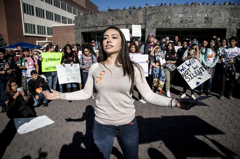 Mexican Immigrant and WSU student Andrea Chavez, 21, speaks about crossing the boarder when she was six-months-old during the WSU College Republicans Trump Wall demonstration and Unity Rally counter protest on the WSU campus, Wed., Oct. 19, 2016, in Pullman, Wash. (Colin Mulvany / The Spokesman-Review)