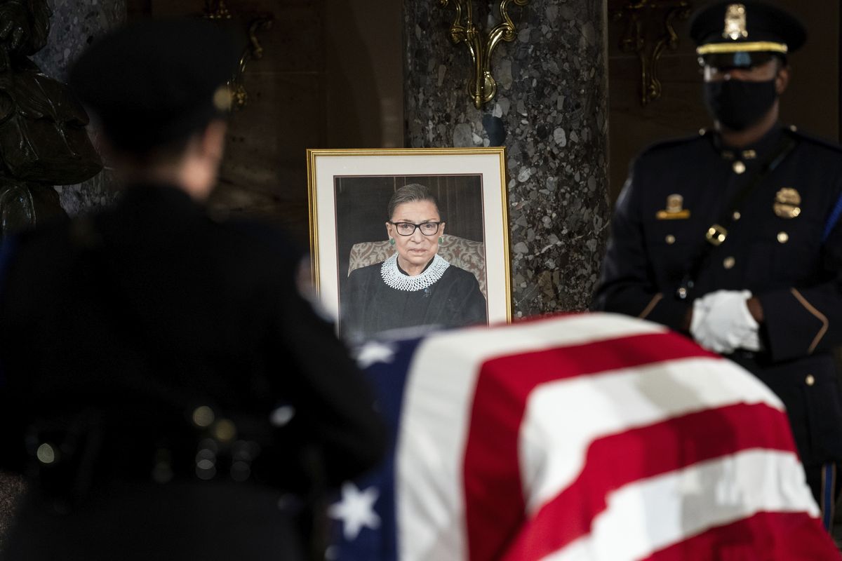 The flag-draped casket of Justice Ruth Bader Ginsburg lies in state in the U.S. Capitol last Friday. Ginsburg died at the age of 87 on Sept. 18.  (Erin Schaff)