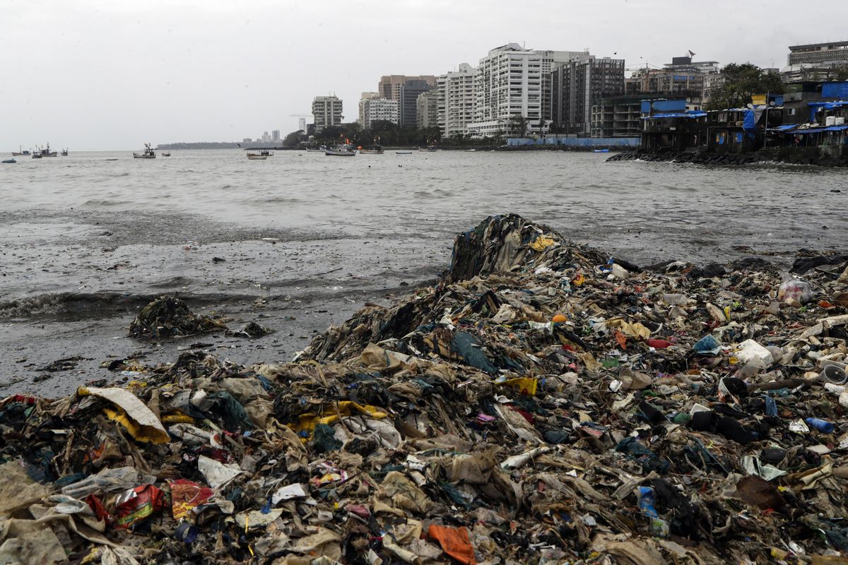 Plastic and other trash that got washed ashore on the Arabian Sea coast in Mumbai, India, Monday, Aug. 9, 2021. Earth’s climate is getting so hot that temperatures in about a decade will probably blow past a level of warming that world leaders have sought to prevent, according to a report released Monday that the United Nations called a “code red for humanity.”  (Rajanish Kakade)