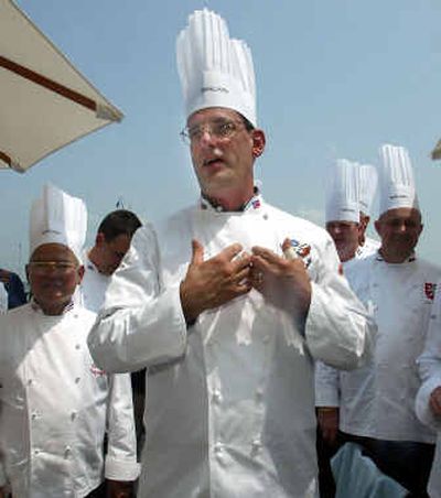 
White House Chef Walter Scheib, center, greets chefs from around the world at the Chesapeake Bay Maritime Museum in St. Michaels, Md., in 2004.
 (File/Associated Press / The Spokesman-Review)