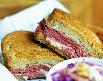 
 Reuben, the ultimate deli sandwich, is typically  made with rye bread and Russian dressing, piled high with corned beef, Swiss cheese and sauerkraut, then grilled until golden. 
 (Associated Press / The Spokesman-Review)