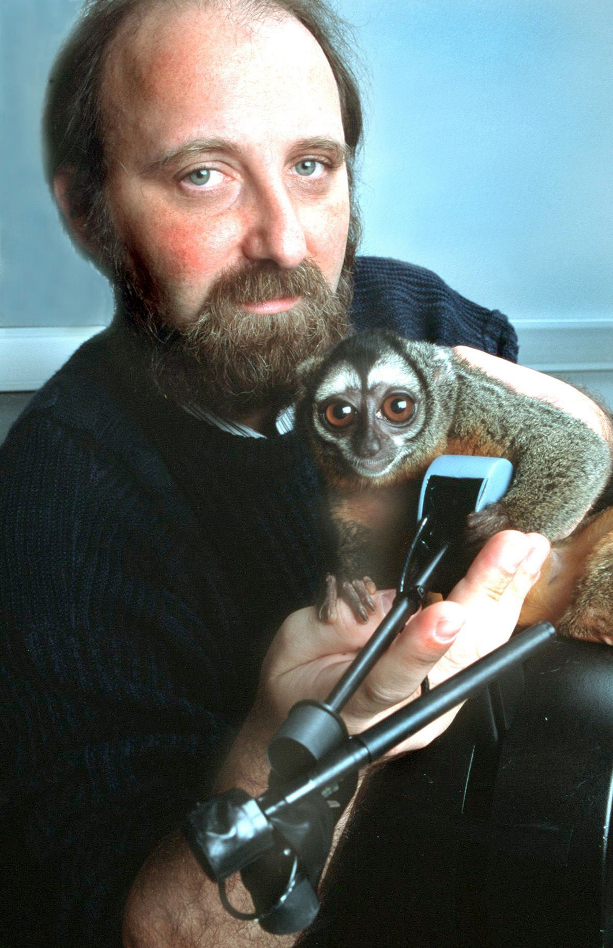 In 2000, Duke University researchers trained an owl monkey to use its mind to control a robotic arm, using a device implanted into the motor cortex of its brain. "This was only the beginning of a promising journey," wrote lead scientist Miguel Nicolelis, shown with another owl monkey. The Washington Post photos (The Washington Post photos / The Spokesman-Review)