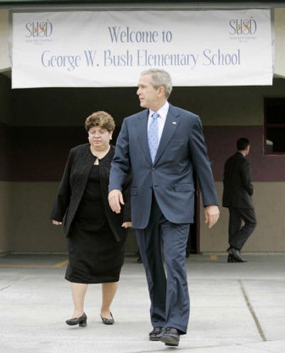 
President Bush walks out to speak to reporters during his visit Tuesday to George W. Bush Elementary School in Stockton, Calif. In his remarks, Bush praised House Speaker Dennis Hastert, who is fighting calls to resign. 
 (Associated Press / The Spokesman-Review)