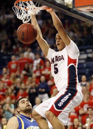 Gonzaga's G.J. Vilarino dunks in front of Cal State Bakersfield's Jose Lara during the second half of an NCAA college basketball game at the McCarthey Athletic Center in Spokane, Wash., Tuesday, March 2, 2010.  Gonzaga won 78-59.
  (Associated Press)