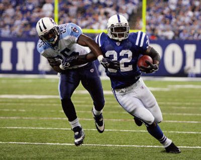 
Colts RB Edgerrin James (22) rips off a 21-yard gain Sunday.
 (Associated Press / The Spokesman-Review)