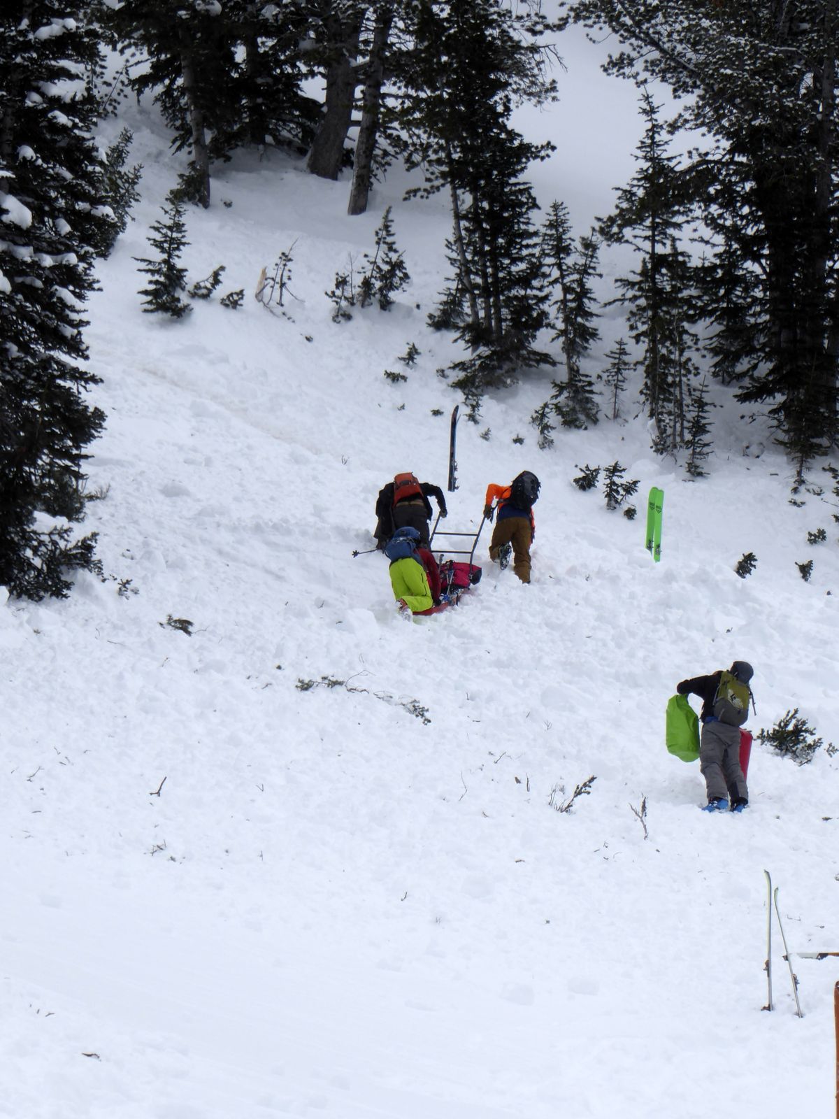 A ground team approaches the area of an avalanche in Montana’s Gallatin National Forest on Sunday. A backcountry skier, Craig Kitto, 45, of Bozeman, suffered fatal injuries when the slope he and a companion were climbing cracked without warning, collapsed and swept him downhill into a tree. The other person wasn’t hurt.  (HOGP)