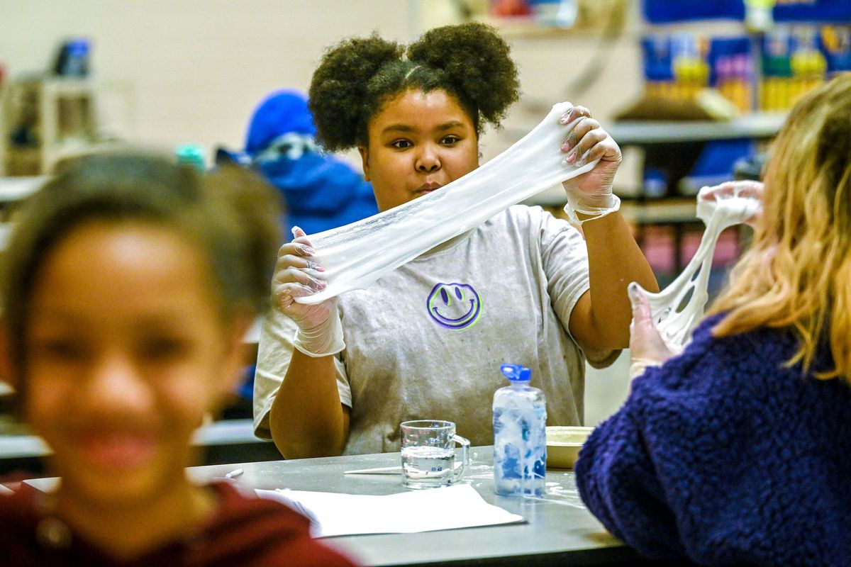 Lidgerwood Elementary fifth-grader Remi Olajoyegbe makes slime during an after-school program in Spokane on Monday.  (Kathy Plonka/The Spokesman-Review)