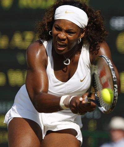Serena Williams drills a backhand shot in her quarterfinal match Tuesday.  (Associated Press / The Spokesman-Review)